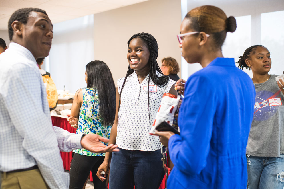 Posse students receive support at BU from faculty mentors and from one another in regular gatherings. Among those at a September 13 reception at the GSU for Posse Scholarship recipients are Christian Vanleer (CAS 21) (from left), Kesha Perkins (CAS 21), and Aria Armstrong (SAR 20).