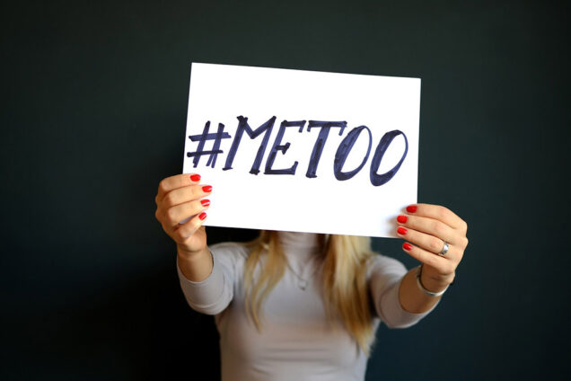 woman holding #metoo poster