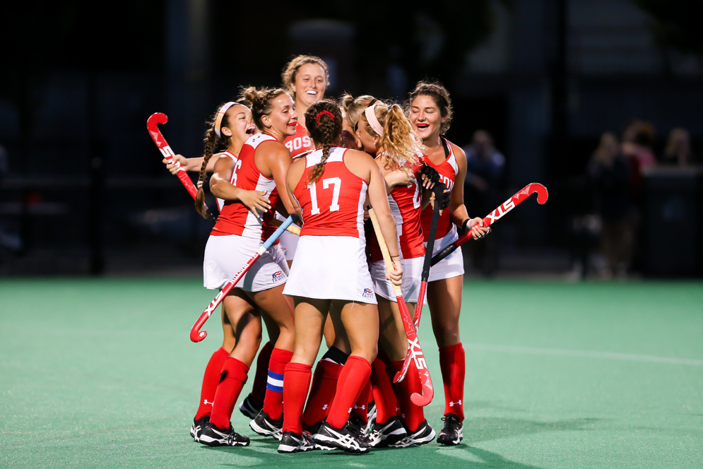 bu women's field hockey team celebrating