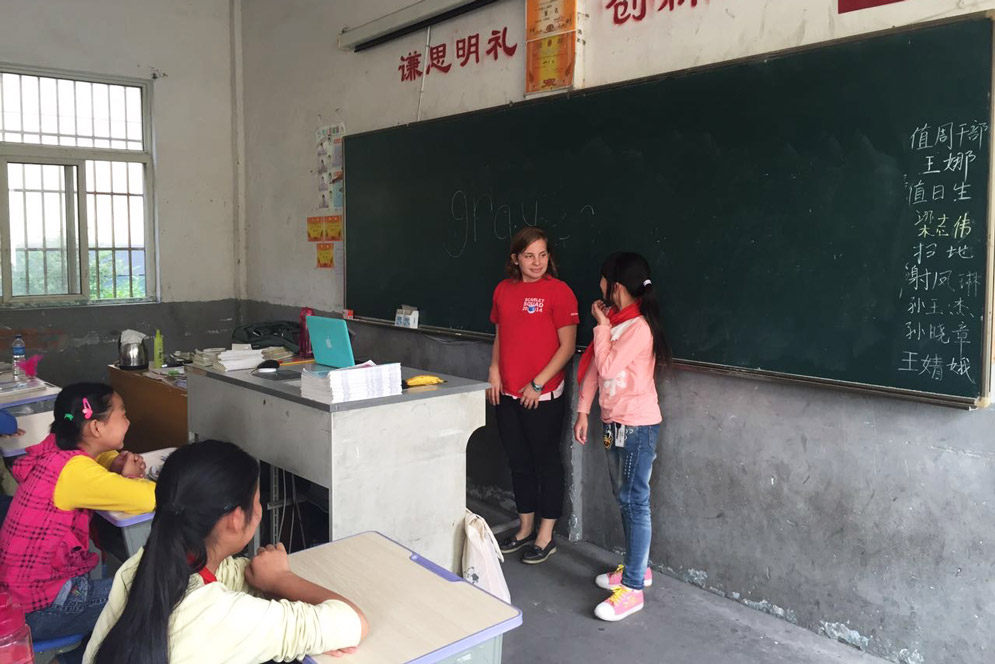 Clarinda Blais stands in a classroom teaching english in rural China.