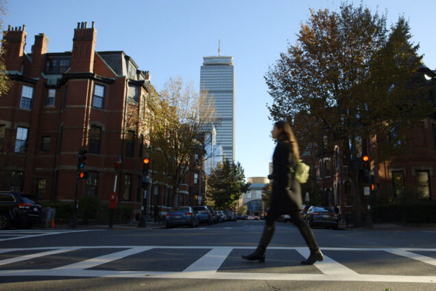 Kate Weiser (COM’19) walks down a street in Boston.