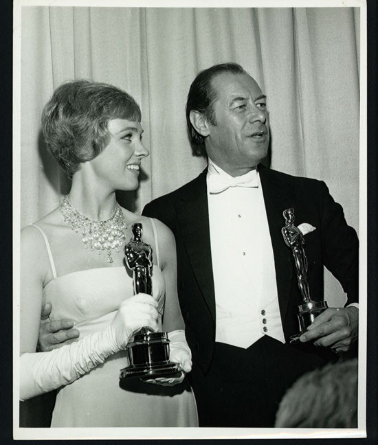 Photo of Oscar winners Rex Harrison and Julie Andrews at the 1965 Academy Awards.
