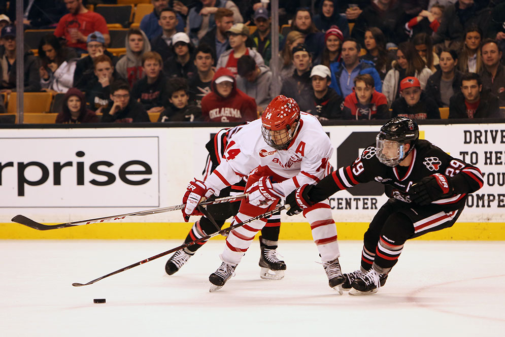BU Terriers men's hockey player Bobo Carpenter fights for the puck during the 2018 Beanpot Tournament men's hockey championship game