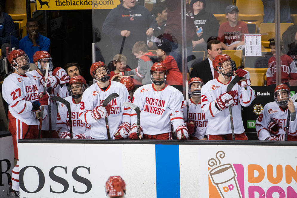 Boston University men's hockey team watches from the bench during the 2018 Beanpot Tournament championship