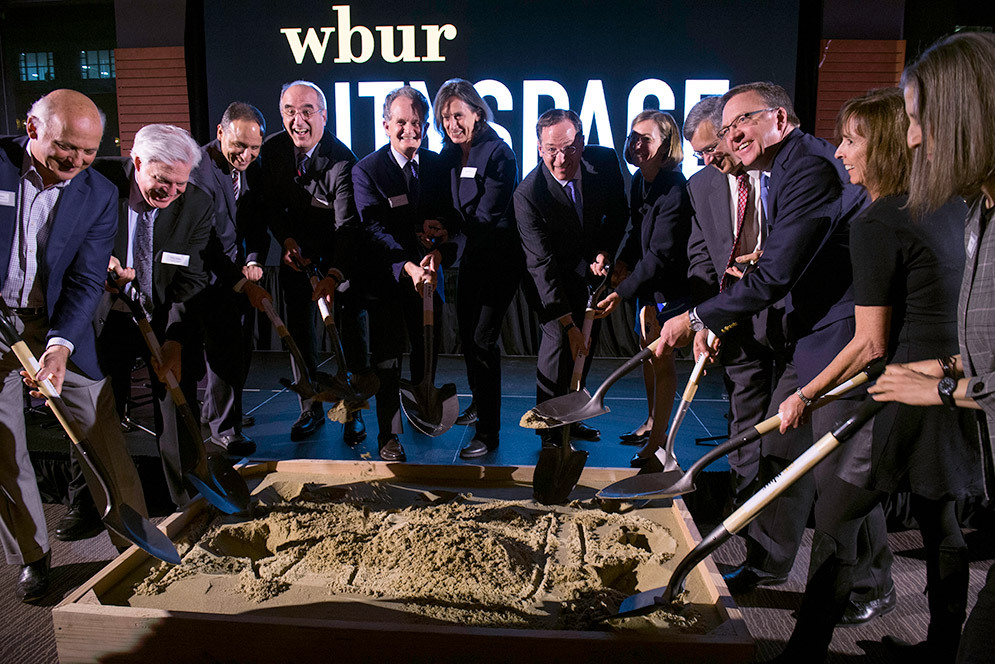 Lead funders for WBUR’s CitySpace dig their shovels into a pit of sand during the ground breaking ceremony and celebration of the upcoming, state-of-the-art multimedia venue.