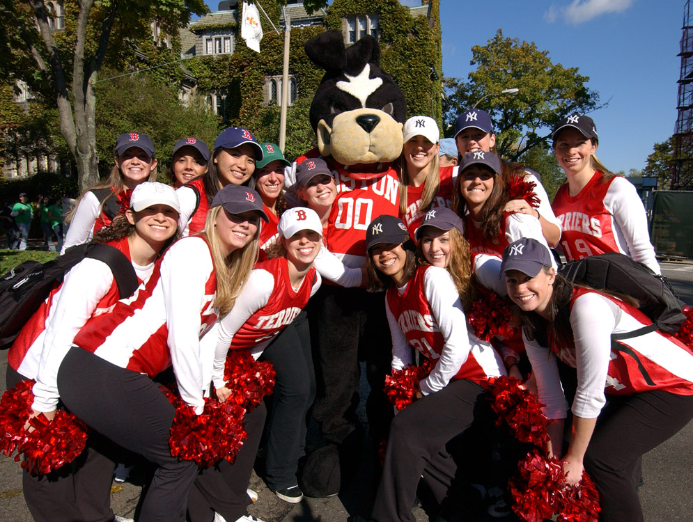 Rhett surrounded by cheerleaders during the 2004 Homecoming Parade at Boston University