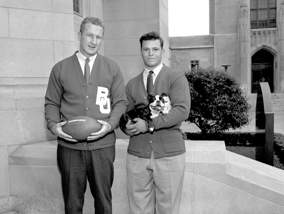 1957 Football captains Jack Regan and Larry Vinecour pose with the BU Mascot, then named Fumbles.