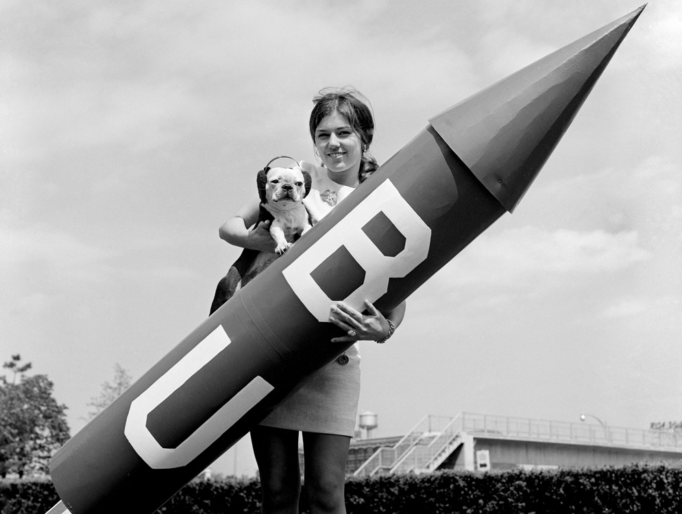 A student poses with the BU mascot and a big firecracker during the University's centennial celebration in 1969