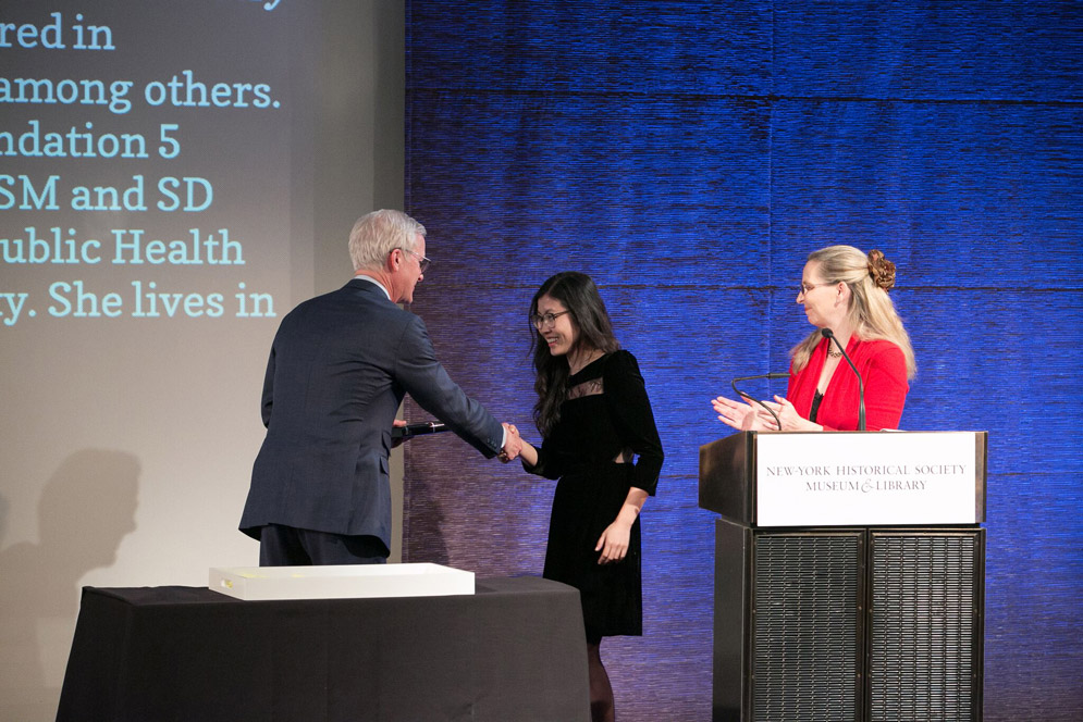 Weike Wang accepts a Whiting award onstage.