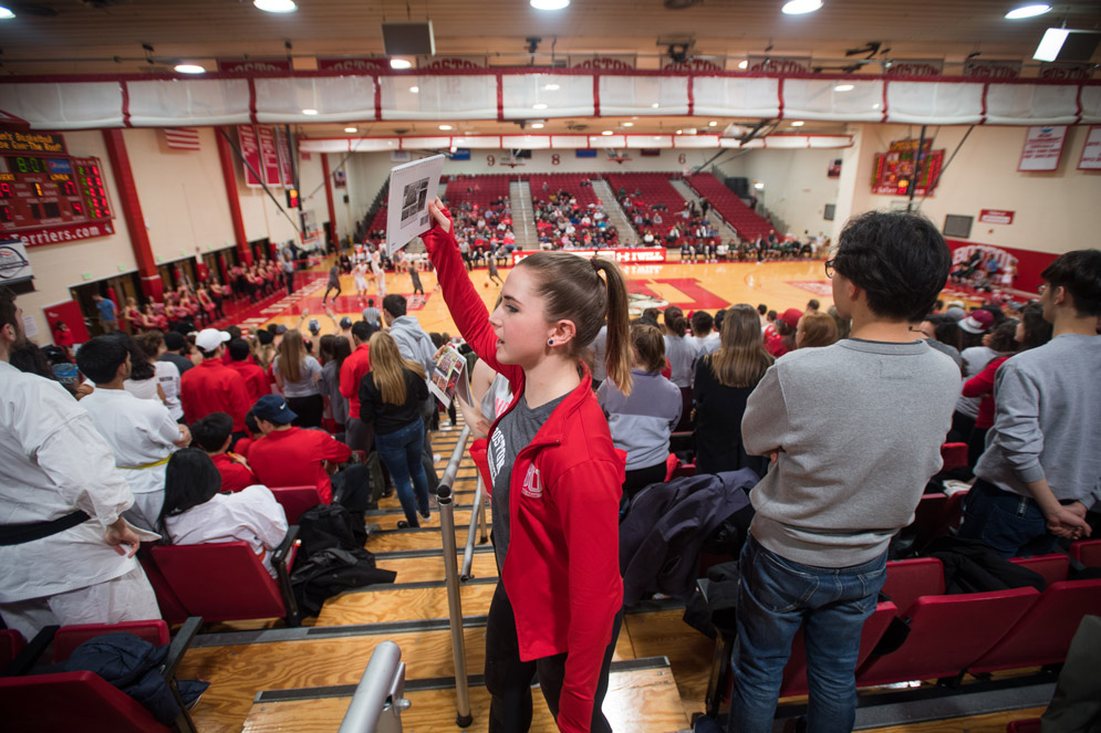 Dance team sells calendars at basketball games