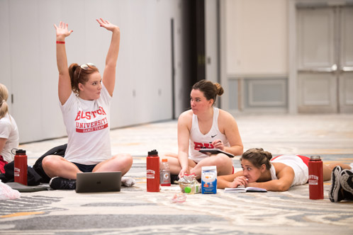 Assistant coach Taylor Littlefield coaches dance team members 