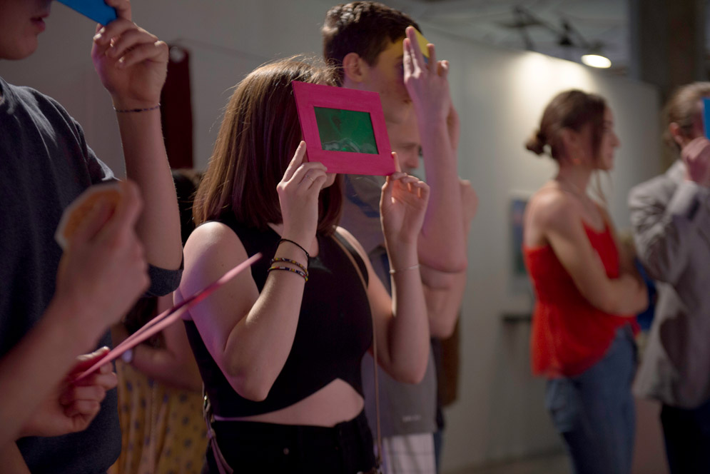 Visitors use a series of colored lenses to explore an artwork 