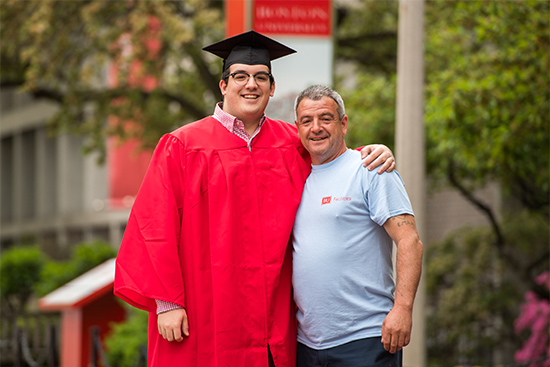 Boston University Class of 2018 Graduate Andrew Almeida with Father Eddie Almeida