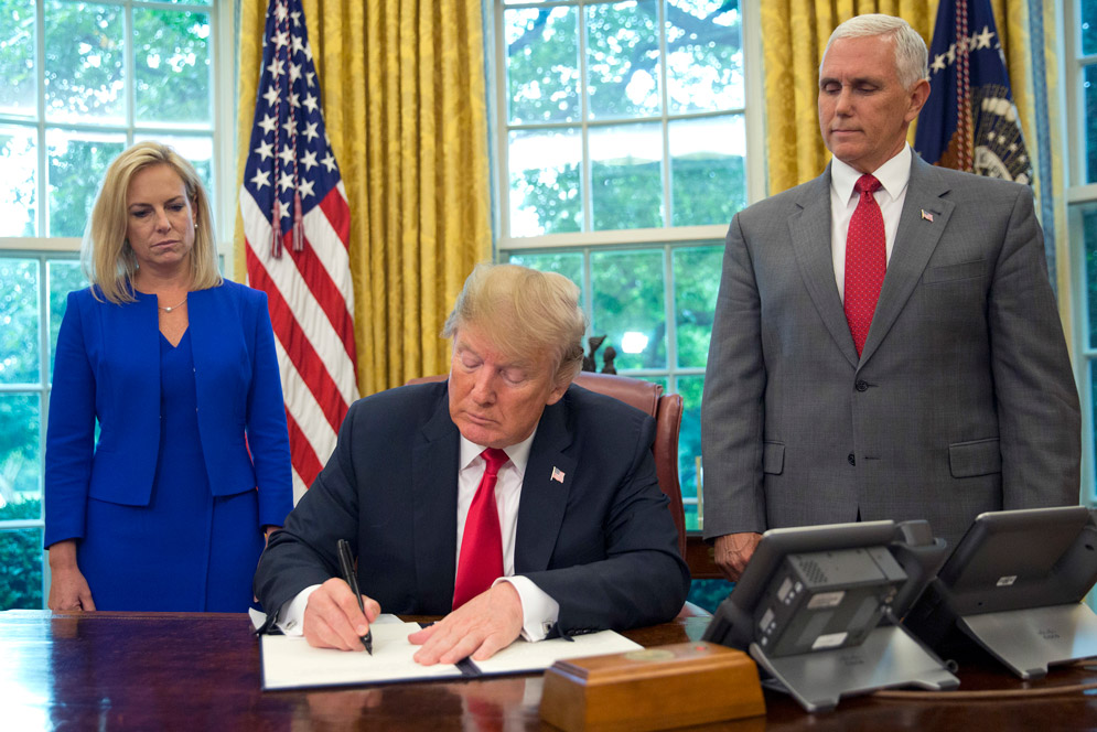 Trump signing an executive order to stop the separation of families