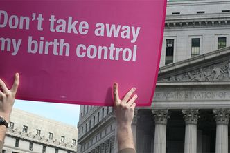 A Planned Parenthood supporter holds a sign that says "Don't take away my birth control" at a rally in New York City.