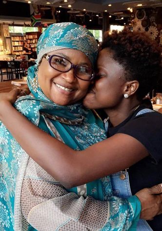 Fatima Dainkeh and her mother embrace