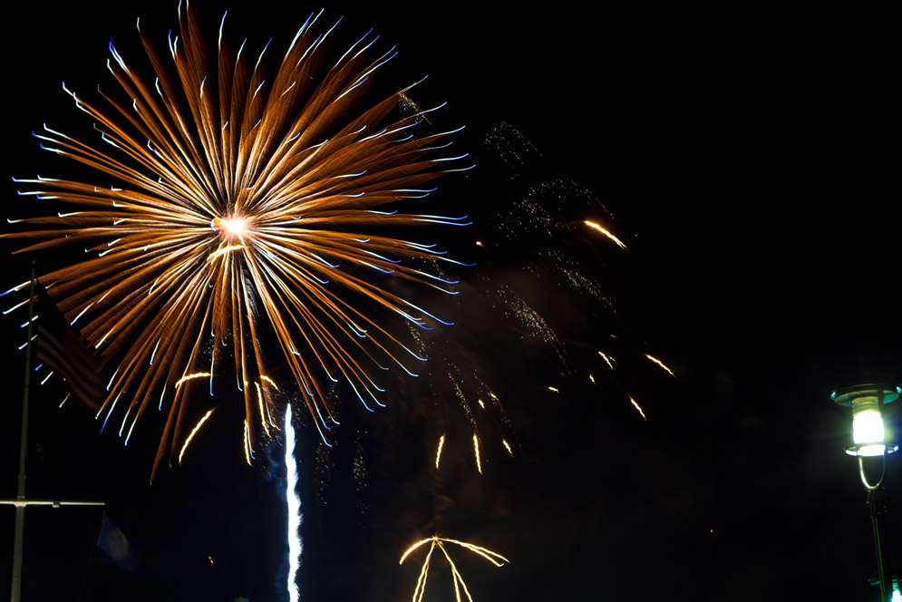 Fireworks illuminate the Boston Harbor