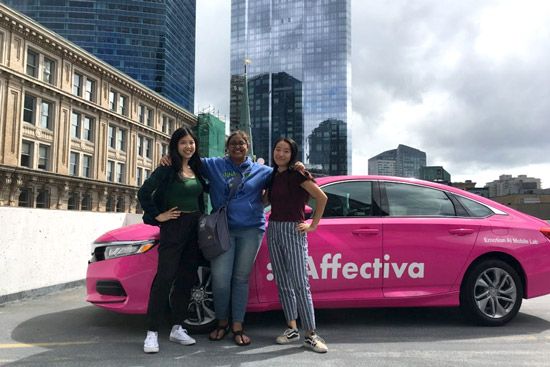 Students pose with an Affectiva car