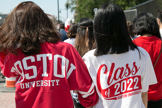 Students from the Boston University Class of 2022 march down Commonwealth Ave toward the Matriculation ceremony wearing Boston University Class of 2022 t-shirts
