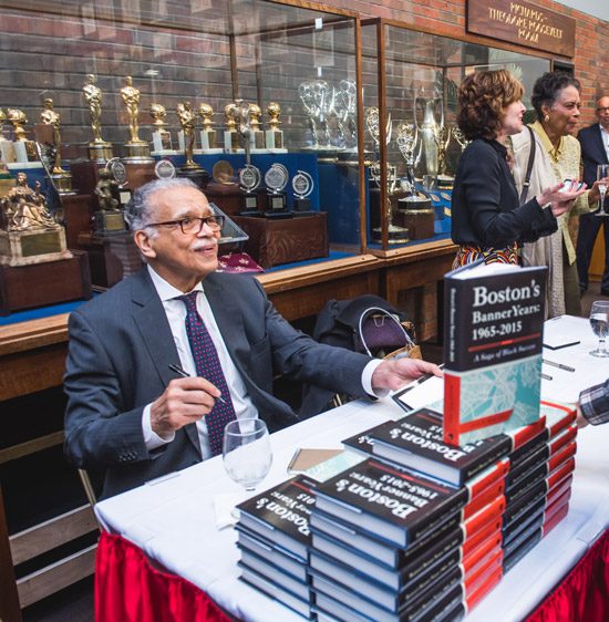 Melvin B. Miller signing copies of his new book