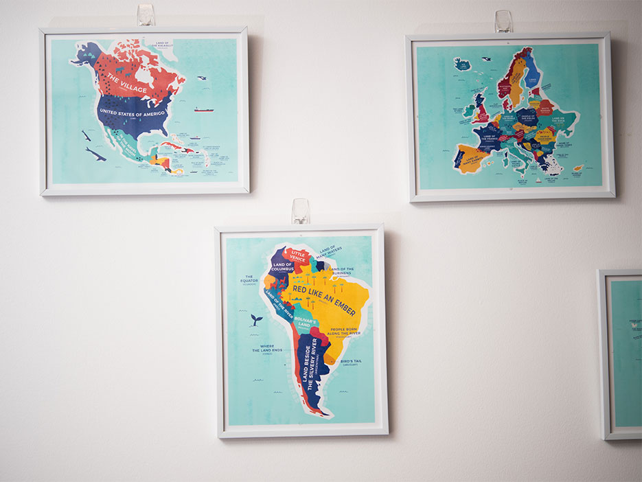 3 framed maps hanging on the wall of a Boston University dorm