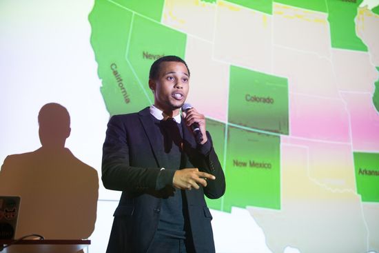William Belt on stage during his presentation