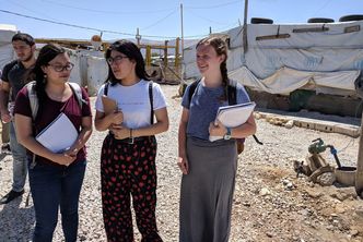 Misty Ouyang, Jessica Thai, and Sheila Phillips speak while visiting the Saadnayel settlement in Bekaa Valley, Lebanon