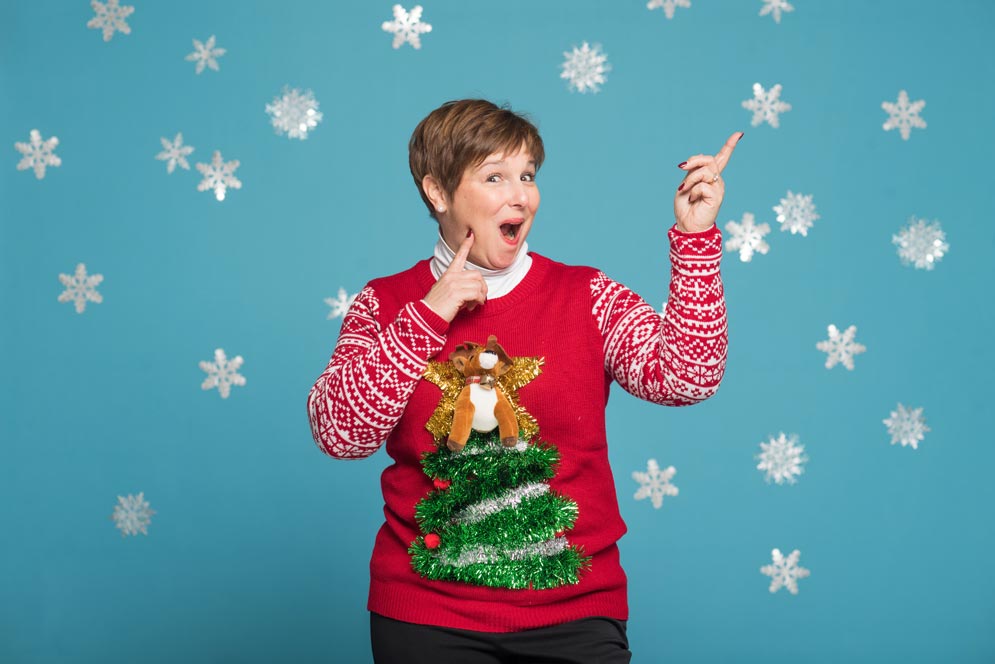 Paula Maxwell wears a appliqued reindeer and Christmas tree sweater