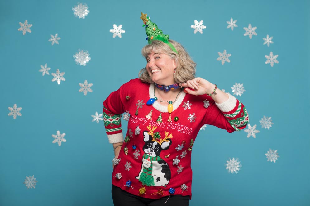 Suzanne Markham Bagnera's sweater has a terrier wearing reindeers on it.