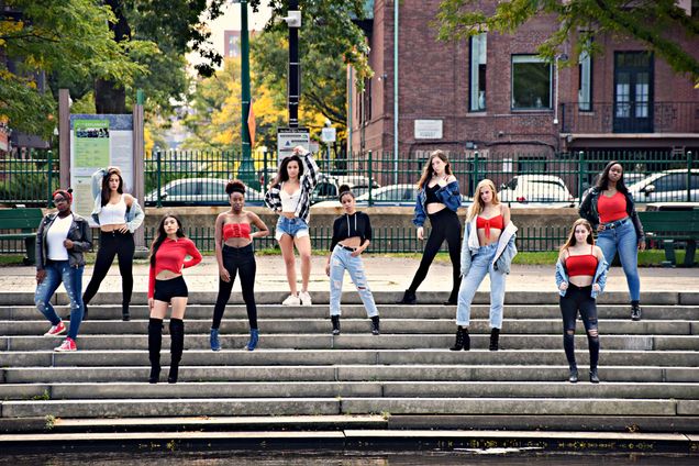 Portrait of the Vibes women-only dance team posing on stairs outside in Boston