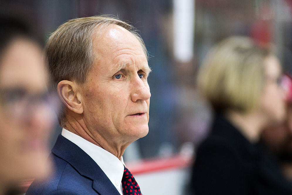 Close-up face shot of BU women's ice hockey head coach Brian Durocher watching the game from te bench during the first period of the Beanpost championship game.