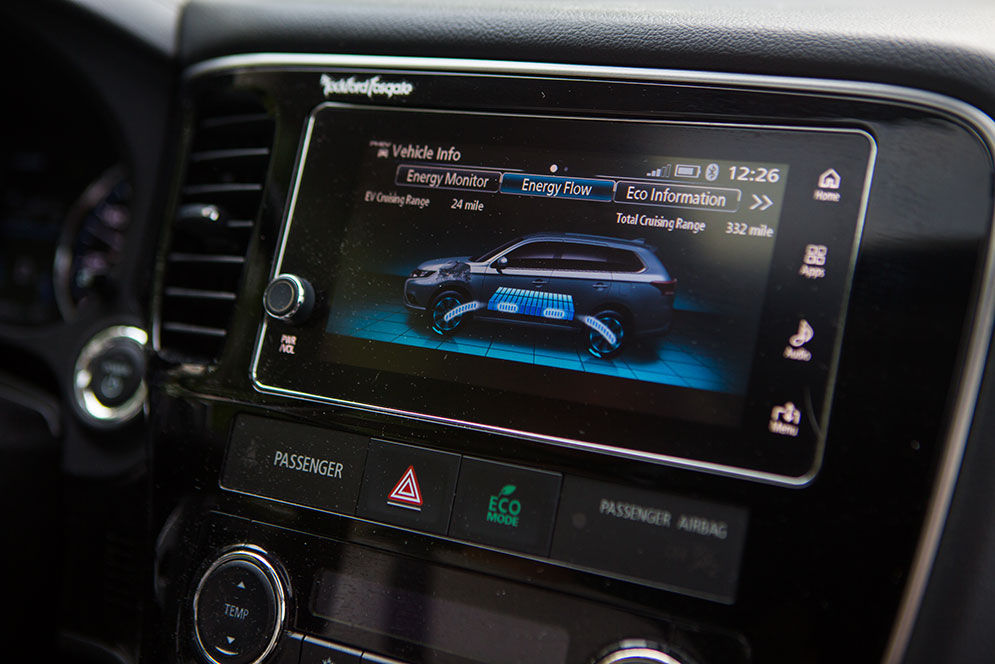 The dash panel of Mike Wagner's Mitsubishi Outlander PHEV hybrid vehicle showing the energy flow of the vehicle while in motion.