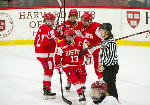 Natasza Tarnowski, center, celebrates her 2nd period goal with her fellow Terrier teammates.