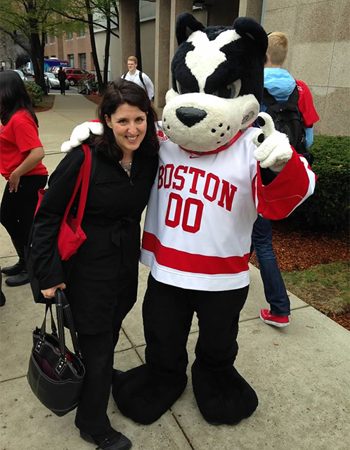 Boston University professor Amy Shanler poses with BU mascot Rhett