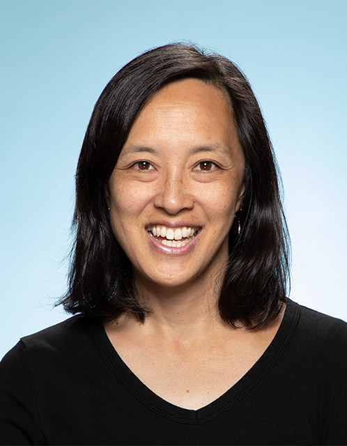 Portrait of BU College of Engineering professor Joyce Wong on a blue background