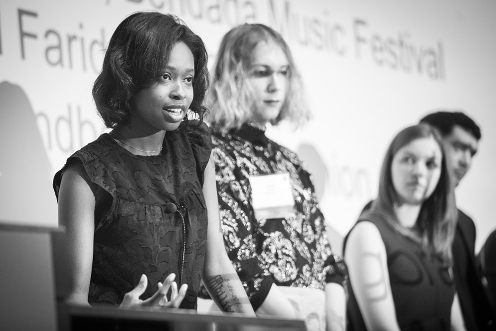 BU entrepreneurs Ellice Patterson, Dielle Lundberg, and Inês Andrade answer questions at the podium during the IDEA 2019 conference.