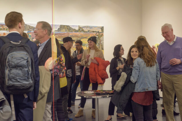 Fine art students, their friends. family and strangers attend the MFA thesis exhibition at Laconia Gallery on Apr. 5, 2019. College of Fine Arts students Elizabeth Flood, Katherine Gardener, Zak Shiff, Samuel Guy and Gus Wheeler exhibited their graduate thesis projects.