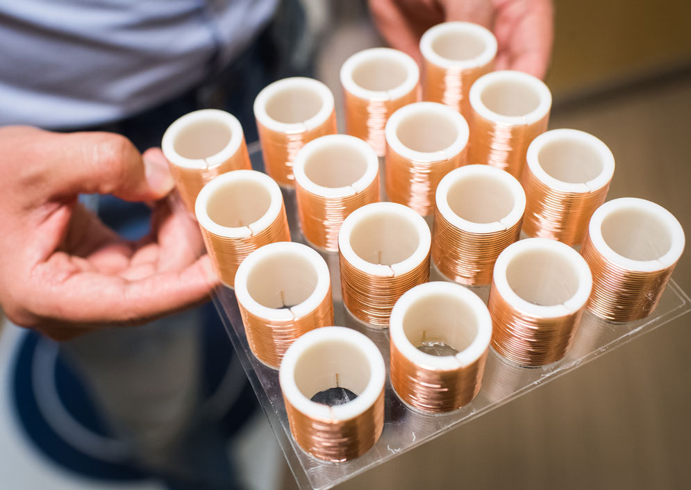 This array of helical resonators stand at three-centimeter-tall, constructed from 3-D-printed plastic and coils of thin copper wire.