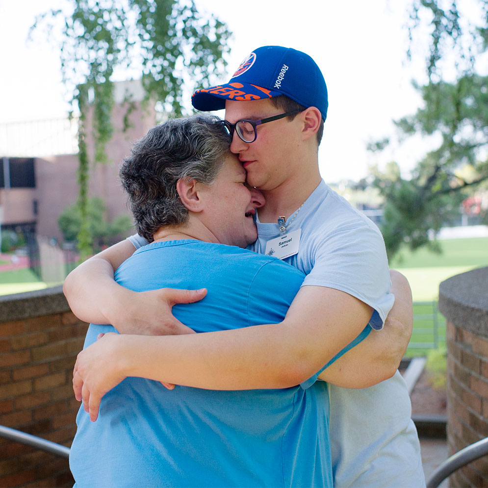 Boston University student Sam DeSoto hugs his mother goodbye during fall semester move-in weekend.