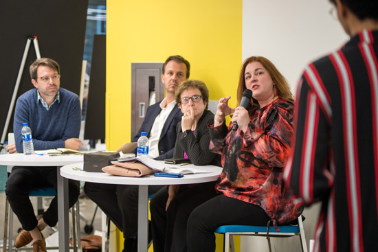 Aaron Rasmussen, George Zaczac, Jr., Judith S. Hurwitz, and Elizabeth Lawler asking questions of one of the student presenters