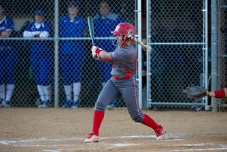 Emily Morrow swinging a metal bat