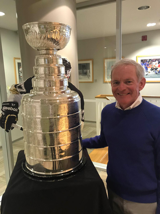 Whalen standing next to the Stanley Cup