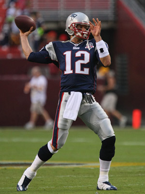 Tom Brady about to throw a football