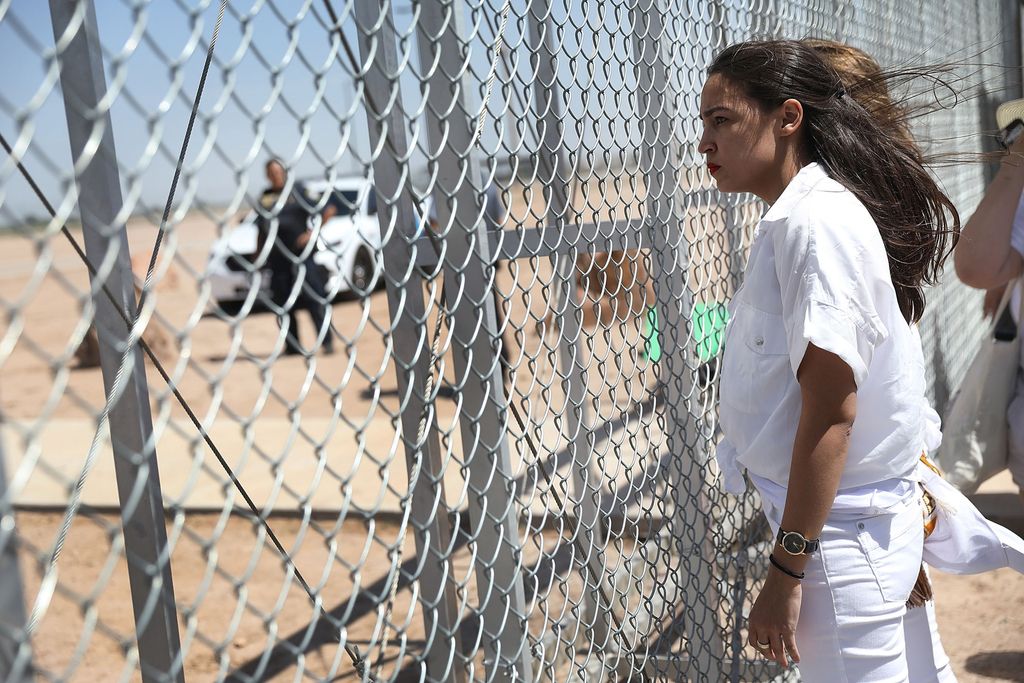 Alexandria Ocasio-Cortez (CAS’11) stands at the Tornillo-Guadalupe port of entry gate in Texas 