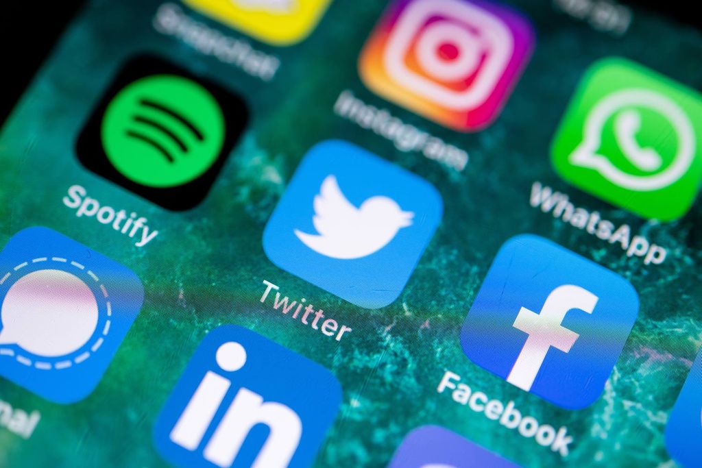 HiRes photo of a smartphone home screen filled with social apps.