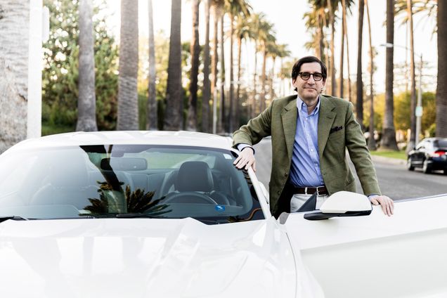 Alessandro Uzielli poses with a white mustang