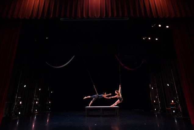 Two dancers practice their bungee dance routine on stage