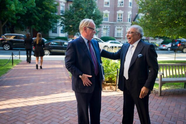 Rajen Kilachand and Boston University President Robert A. Brown exchange a laugh.
