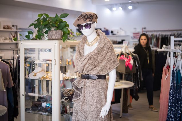 A mannequin inside Covet is draped in fashionable cheetah print