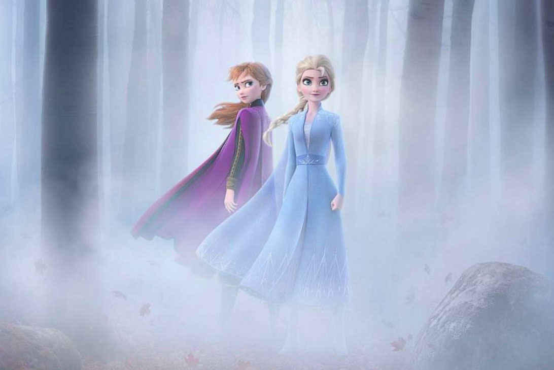 A movie poster for Frozen II depicting Anna and Elsa in a wooded area
